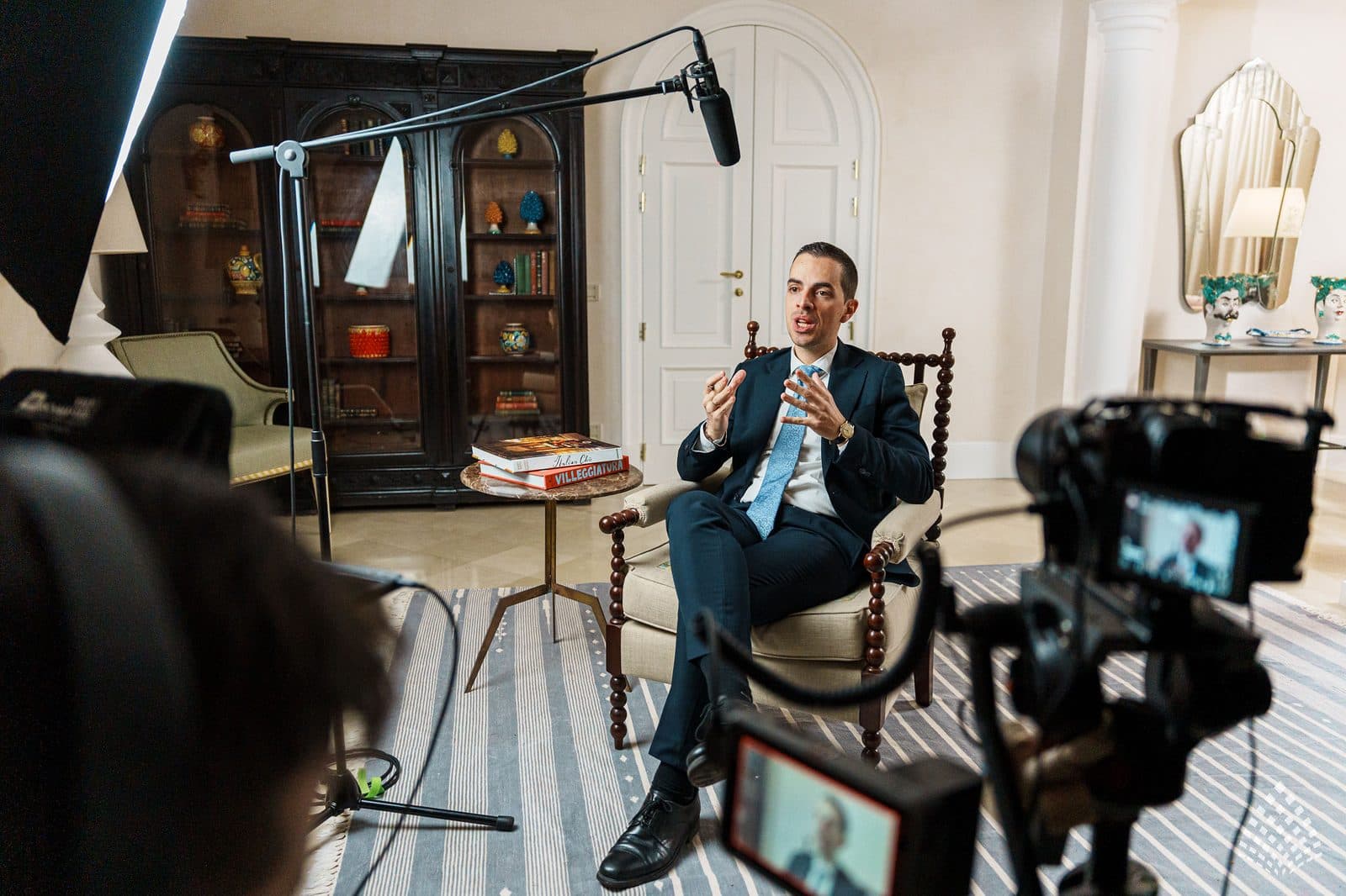 Antonio Cannavò being filmed in the library at Villa Sant'Andrea