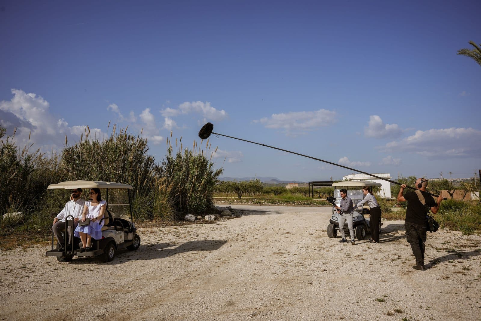 A guest transfer by buggy being filmed across the Verdura estate