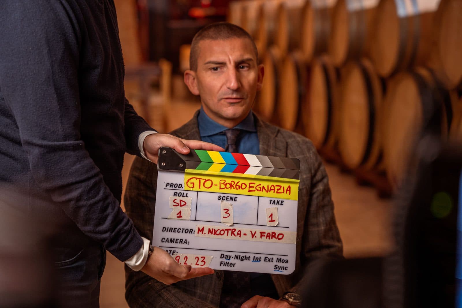 The clapperboard before a take in the barrel cellar at Borgo Egnazia